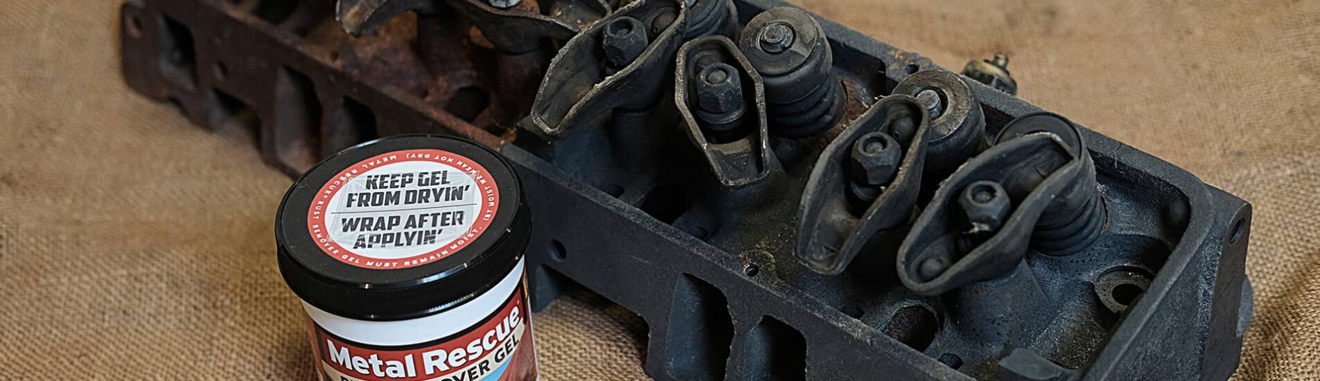 Metal Rescue Rust Remover GEL next to engine component